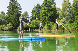 Children using the paddle boats to enjoy there morning out.