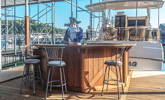 Wooden par with a skeleton serving drinks.