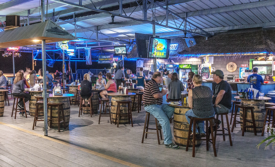 Group of people enjoying themselves at the bar.